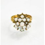 A 14ct gold and opal cluster ring, size N/O, 3.2g.