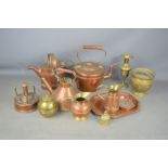 A group of copper and brass ware to include copper kettles, Liptons souvenir copper tea caddy 1924
