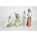 Four Lladro porcelain figurines, of various form.