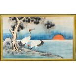A Japanese silk needlework, depicting cranes in the sunset, circa 1920, 34 by 58cm. [Provenance: The