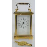 A J.W Benson of London brass cased carriage clock with roman numeral dial, with key