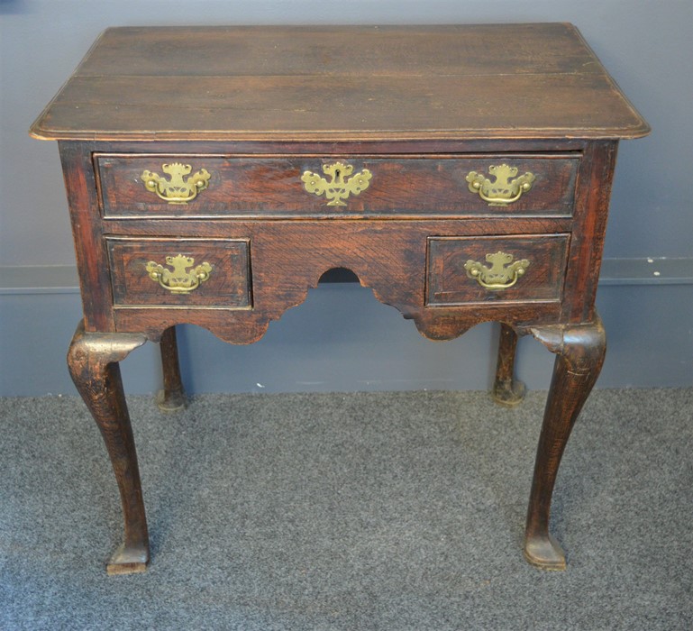 An 18th century oak lowboy. 70cm high x 74cm wide x 46cm