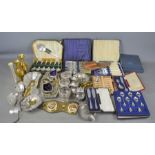 A group of brassware and silver-plate to include boxed flatware, vase, horse brasses and other