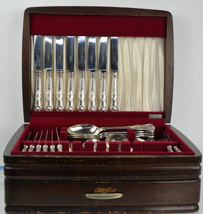 A canteen of cutlery in an oak case.