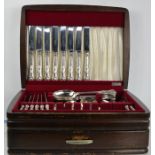 A canteen of cutlery in an oak case.