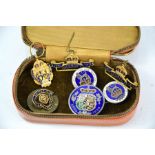 A group of various badges to include Royal British Legion, Coronation of Queen Mary and other