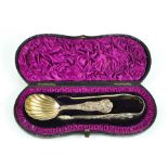 A silver caddy spoon and sugar nip set, embossed with mythological scene, bearing residual
