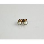 A pair of 9ct gold and pearl earrings.