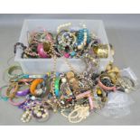 A large quantity of costume jewellery to include bracelets, necklaces etc