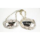 Two silver bottle tags: Gin and Sherry, both embossed with decoration, 0.73toz.