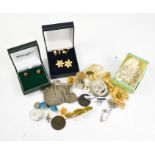 A group of jewellery to include silver chain link bag, coins, brooches and earrings.