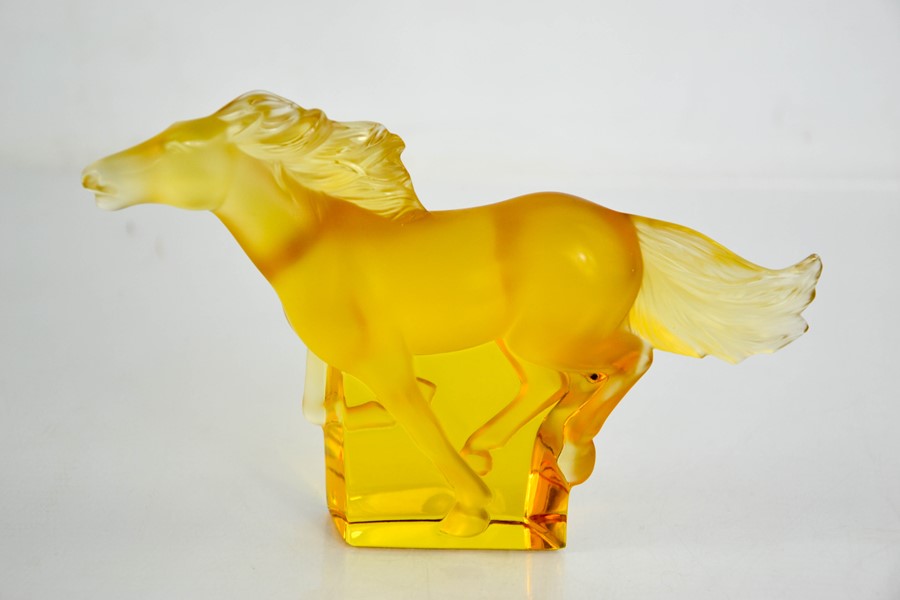 A Rene Lalique Kazak glass amber horse, etched Lalique. 11.5cms x 18cms