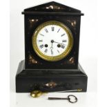 A Victorian slate and marble mantle clock with Roman numeral dial, with key and pendulum, 27cm high
