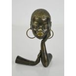A Studio Art Deco period metal work sculpture, circa 1930, African lady with hoop earrings,