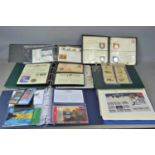 A group of first day covers and coin covers to include coins and stamps of the world