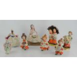 A group of percelain figurines to include Capodimonte, Dresden and others