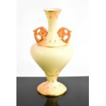 A Locke & Co Worcester porcelain blush ivory vase with twin handles.22cm high.