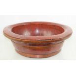 A Chinese red lacquer wooden bowl50cm diameter by 17cm high