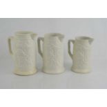 A set of three Victorian graduated jugs embossed with face masks