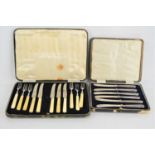 A cased set of silver handled butter knives together with a cased set of pickle knives and forks