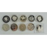 A group of ten silver and silver proof coins to include George V crown, Charles Darwin crown, Mary