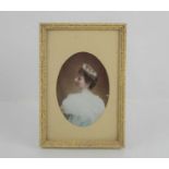 A 19th century hand painted miniature portrait on porcelain of a young lady