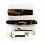 A miniature mother of pearl pen knife, together with a tortoiseshell cased pair of folding