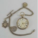 A 19th century James Reid and Co of Coventry silver pocket watch with Albert chain and various fobs