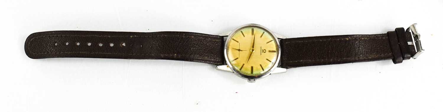 A Vintage Omega wristwatch, with brown leather strap, together with the original Omega