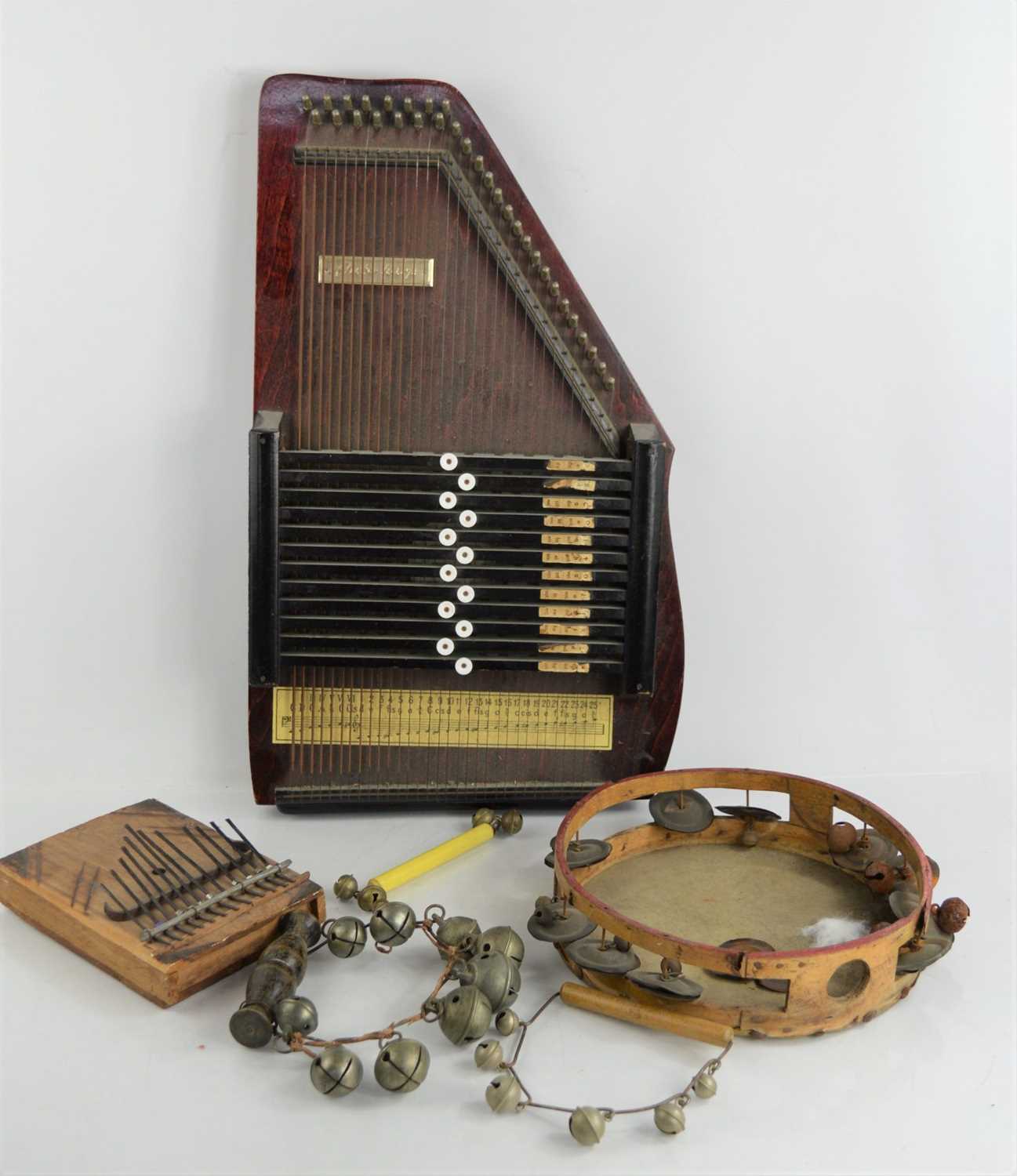 A vintage Autoharp, tambourine and further instrument