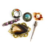 A Scottish silver thistle form brooch, and three agate set vintage brooches.