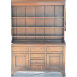 A Victorian oak welsh dresser with rack