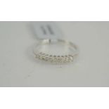 A sterling silver ring set with nine round cut diamonds, size P/Q, 1.78g