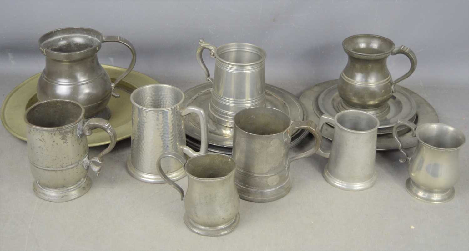 A group of 19th century and later pewter ware to include plates and tankards