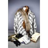 A group of vintage clothing to include gloves, lace, bag, fan, antique lace, a rabbit fur coat and