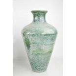 A Studio pottery vase in mottled green glaze, with makers initials inscised to the base, together