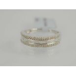 A sterling silver and diamond eternity ring set with round and baguette cut diamonds, size P/Q, 3.