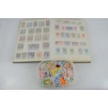 A British and worldwide stamp album and a quantity of loose stamps, a large quantity are mint