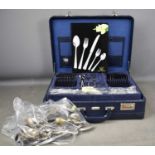 A Solingen Chrom-Nikel-Edelstahl set of cutlery in a suitcase, together with loose various cutlery.