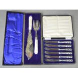 A cased set of six silver handled butter knives together with a silver plate fish serving knife