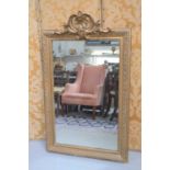 A 19th century giltwood and composition pier mirror with crested top128cm by 77cm
