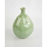 A Chinese green celadon glazed vase in the form of a fruit.16cm high