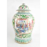 A large 19th century Chinese enamelled jar and cover, with vistas depicting interior scenes with