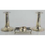 A pair of Edwardian silver column candlestick decorated with bellflowers by James Dixon & Sons