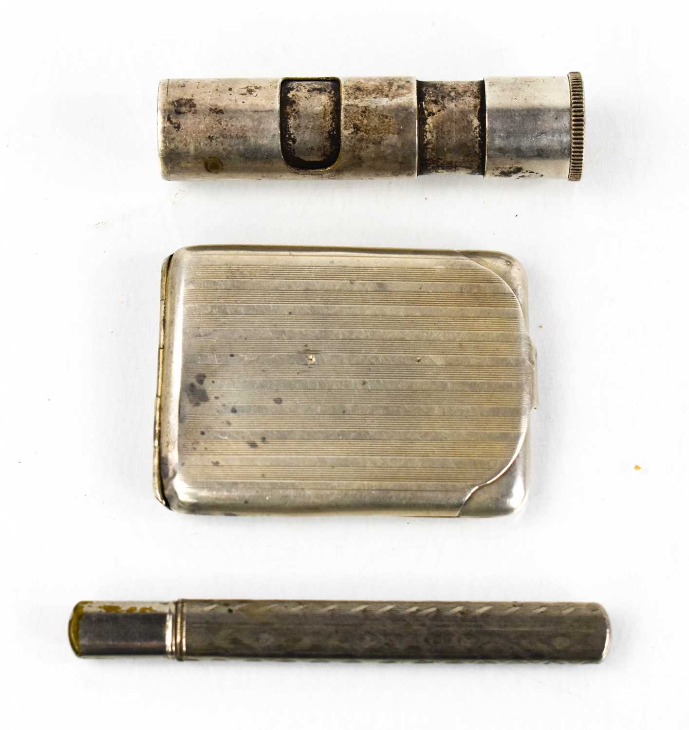 A vintage Totem barrel form lighter, pencil with original holder and a silver vesta case with