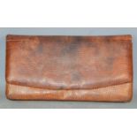 A vintage crocodile skin clutch bag