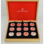 A collection of twelve Royal Canadian Mint $10 fine silver coins in presentation case
