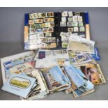 A quantity of used loose stamps, including an album, with UK and worldwide examples.Condition