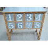 An industrial style sideboard with eight numbered drawers 80cm by 81cm wide