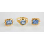 A Portuguese set of gold earrings and matching ring set with blue topaz.